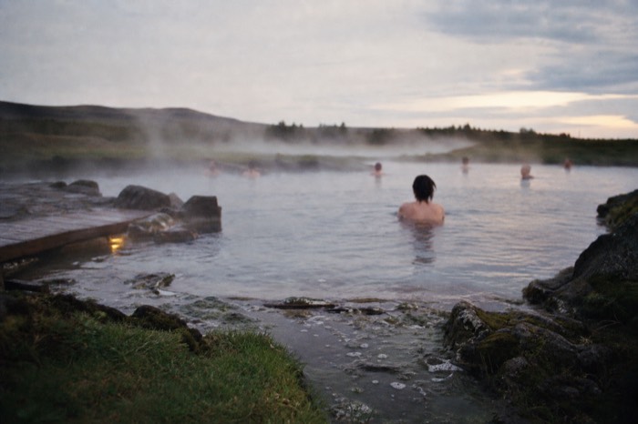 Steam drifting over the natural geothermal water of the Secret Lagoon at Fludir on the Golden Circle